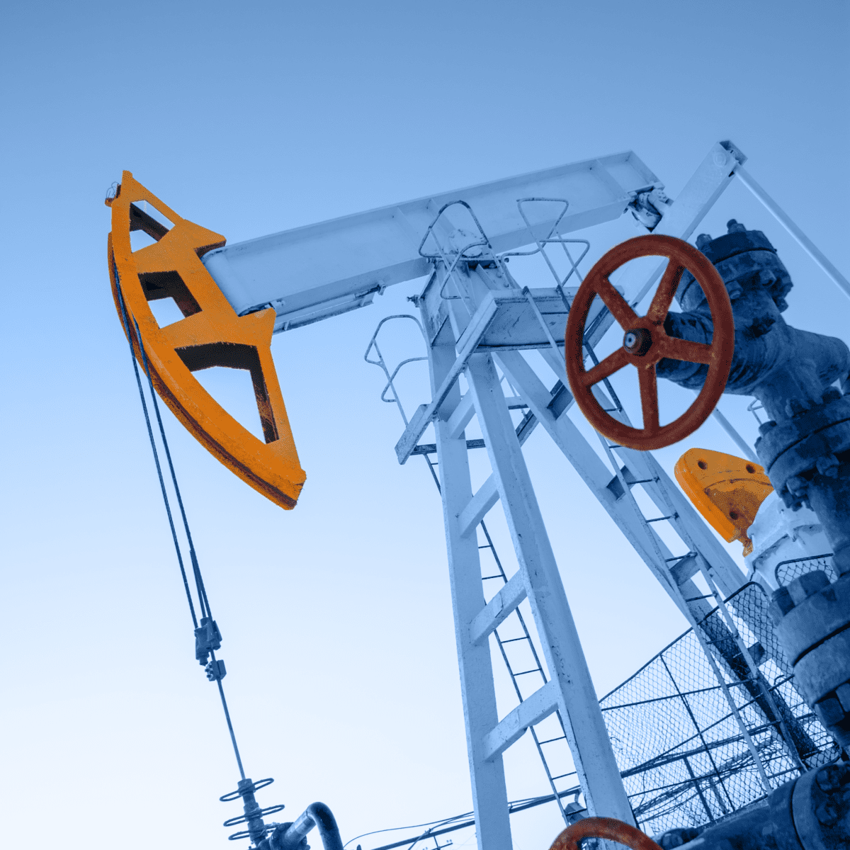 Close-up view of an oil pump jack in operation, showcasing the machinery used for extracting oil from the ground.